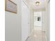 Hallway featuring tile floors and white doors at 25 Mariner Ln, Rotonda West, FL 33947