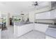 Spacious kitchen with white cabinetry, granite counters, and views of the living areas at 25 Mariner Ln, Rotonda West, FL 33947