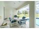 Lanai with outdoor dining set with seating for four at 25 Mariner Ln, Rotonda West, FL 33947