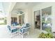 Outdoor living area with ceiling fan and pool view, including dining and lounge areas at 25 Mariner Ln, Rotonda West, FL 33947