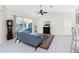 Living room with sliding glass doors to pool, tile floors and a decorative fireplace at 25 Mariner Ln, Rotonda West, FL 33947