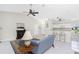 Open living space with vaulted ceilings, neutral tones, a fireplace and tile flooring at 25 Mariner Ln, Rotonda West, FL 33947