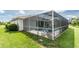 Screened in pool area with furniture for relaxing at 25 Mariner Ln, Rotonda West, FL 33947