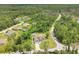 View of a home from above, featuring an inground pool, fenced yard, and lush green landscaping at 2679 Armenia Rd, North Port, FL 34286