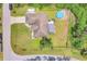 Overhead view of a house showcasing the backyard, fenced yard, and inground pool at 2679 Armenia Rd, North Port, FL 34286