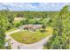 Spacious home featuring an inground pool, fenced yard, and lush green landscaping at 2679 Armenia Rd, North Port, FL 34286