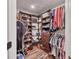 Organized walk-in closet with ample shelving and hanging space, offering storage solutions at 2679 Armenia Rd, North Port, FL 34286