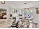 Cozy dining area with shiplap wall, modern lighting, and backyard view, perfect for casual meals and gatherings at 2679 Armenia Rd, North Port, FL 34286