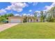 Charming single-story home featuring a well-manicured lawn and attached two-car garage at 2679 Armenia Rd, North Port, FL 34286