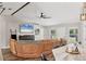 Inviting living room with a large sectional sofa, modern fireplace, and wood-look floors at 2679 Armenia Rd, North Port, FL 34286