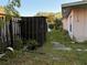 Backyard featuring overgrown grass, shed and a stone path at 2911 Novus St, Sarasota, FL 34237