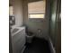 Bathroom featuring a sink, toilet, window, and shower at 2911 Novus St, Sarasota, FL 34237