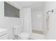 A clean, white bathroom with tile flooring at 348 W Wentworth St, Englewood, FL 34223