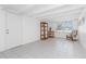 A bright bonus room with tile flooring, window, and furniture at 348 W Wentworth St, Englewood, FL 34223