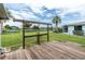Picture of backyard featuring a wooden deck and pond. The backyard also features a chain link fence at 39 Caddy Rd, Rotonda West, FL 33947
