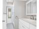 Bathroom features a new vanity with stone countertop, modern fixtures, and updated tile in shower at 39 Caddy Rd, Rotonda West, FL 33947