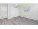 Bright bedroom offers a spacious closet and durable, modern laminate floors at 39 Caddy Rd, Rotonda West, FL 33947
