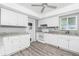 Bright kitchen featuring white cabinets, modern appliances, and ample counter space at 39 Caddy Rd, Rotonda West, FL 33947