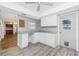 Eat-in kitchen featuring sleek gray counters, ample storage, and a stylish ceiling fan at 39 Caddy Rd, Rotonda West, FL 33947