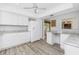 White kitchen with granite countertops, stainless steel appliances, and an eat-in bar at 39 Caddy Rd, Rotonda West, FL 33947