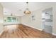 Spacious living room boasts hardwood floors and ample natural light from the large window at 39 Caddy Rd, Rotonda West, FL 33947