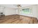 Inviting living room with a large window and durable, wood-look laminate floors at 39 Caddy Rd, Rotonda West, FL 33947