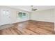 Cozy living room with a picture window, front door, and wood-look flooring at 39 Caddy Rd, Rotonda West, FL 33947