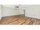Spacious living room with new flooring, ceiling fan, and large windows at 39 Caddy Rd, Rotonda West, FL 33947
