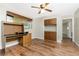Home office offers built-in cabinets and desk space with durable, wood-look laminate floors at 39 Caddy Rd, Rotonda West, FL 33947