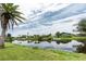 Waterfront property with a private canal, boat dock, and lush landscaping at 39 Caddy Rd, Rotonda West, FL 33947
