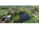 Beautiful aerial view of homes backing up to a large community lake and golf course at 39 Pine Valley Ct, Rotonda West, FL 33947
