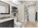 Well-lit bathroom featuring a vanity with a dark wood cabinet and a shower-tub combination at 39 Pine Valley Ct, Rotonda West, FL 33947