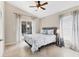 Bright bedroom with a ceiling fan, sliding door leading to the lanai, and neutral color palette at 39 Pine Valley Ct, Rotonda West, FL 33947