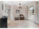 Living room with tile flooring, large window, and a comfortable sitting area at 39 Pine Valley Ct, Rotonda West, FL 33947