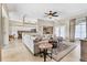Neutral living room featuring a seamless transition to the kitchen and backyard at 39 Pine Valley Ct, Rotonda West, FL 33947