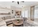 Cozy living room featuring a modern ceiling fan, and seamless layout to the kitchen at 39 Pine Valley Ct, Rotonda West, FL 33947