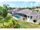 Aerial view of screened in pool area and backyard at 39 Pine Valley Ct, Rotonda West, FL 33947