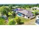 Overhead shot of home and screened in pool with backyard area at 39 Pine Valley Ct, Rotonda West, FL 33947