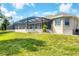 Screened in pool and back yard of this lovely home at 39 Pine Valley Ct, Rotonda West, FL 33947