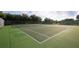 Well-maintained community tennis court with a new net and fresh court surface at 39 Pine Valley Ct, Rotonda West, FL 33947