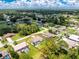 Aerial view of the house showing a large backyard, screened-in lanai and well-maintained landscaping at 4221 Ulster Ave, North Port, FL 34287