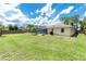 Large green backyard provides an ideal space for Gathering activities and outdoor enjoyment at 4221 Ulster Ave, North Port, FL 34287