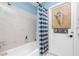 Neutral bathroom with white tile and blue accents, and a nautical themed decoration at 4221 Ulster Ave, North Port, FL 34287