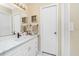 Bright bathroom features a marble-look countertop, matte black faucet, and updated fixtures at 4221 Ulster Ave, North Port, FL 34287