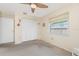 Comfortable bedroom with large closet, window, and carpeted flooring at 4221 Ulster Ave, North Port, FL 34287