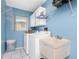 A laundry room with appliances, a sink, and plenty of storage space at 4221 Ulster Ave, North Port, FL 34287
