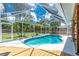 Sparkling screened-in pool offers clear skies, privacy, and a perfect outdoor oasis for relaxation at 4221 Ulster Ave, North Port, FL 34287
