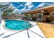 Enjoy the Florida weather in the crystal clear pool with a deck and tropical landscaping at 4221 Ulster Ave, North Port, FL 34287