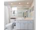 Bathroom featuring vanity with quartz counters and storage and updated fixtures, a toilet, and decor at 4227 Winona St, Port Charlotte, FL 33948
