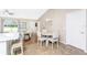 Cozy dining area adjacent to the kitchen, with a modern chandelier and ample natural light at 4227 Winona St, Port Charlotte, FL 33948